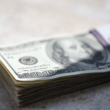 One hundred dollar bills stack