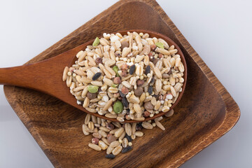 various cereals, seeds, beans and grains on white background.