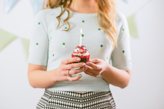 Woman Holding a Birthday Capcake