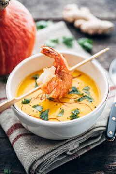 Food: Squash soup with fried prawn, cilantro and chili strings