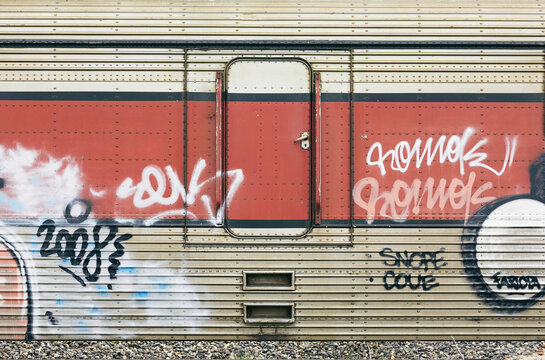 Closed Door of an Abandoned Train with Graffities