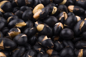 A close up image of heap black beans.