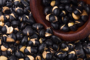 A close up image of heap black beans.