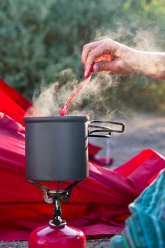 Camping burner and pot with boiling coffee