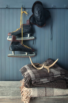 Men's vintage skates hanging on hooks