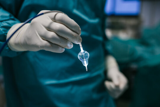 Doctor Operating Using a Laser Balloon