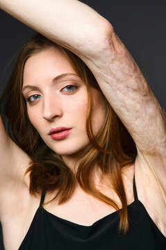 Portrait of beautiful young redheaded woman