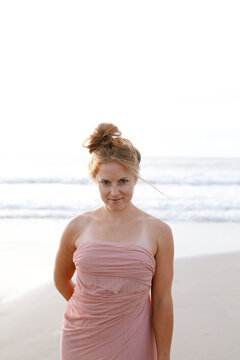 Beautiful woman standing in front of ocean