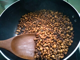 Coffee beans roasted in a pan
