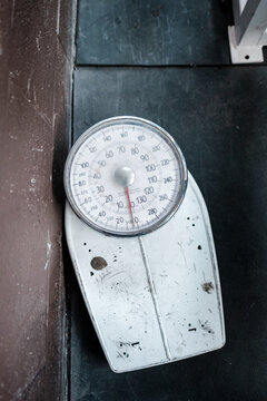 An old body weight scale from above.