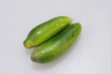 Organic Raw green Coccinia grandis or Ivy gourd on a white background