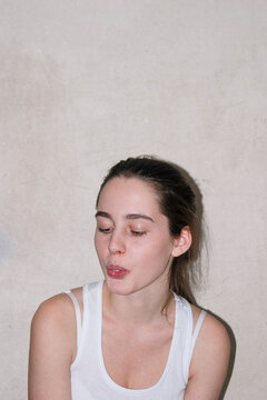 Portrait of young woman chewing the cud