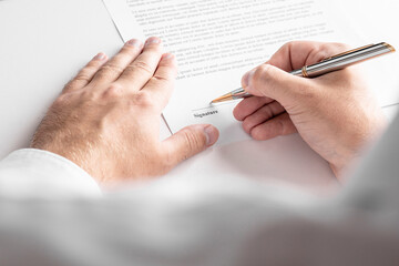 Businessman is signing a contract, business contract details