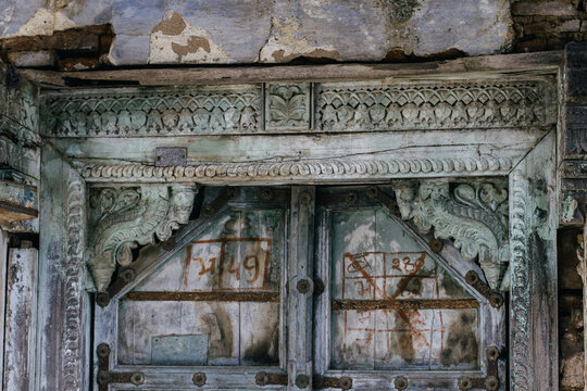 An ornate doorway, blue wood, carved ornately