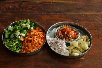 Mixed vegetables on wood background