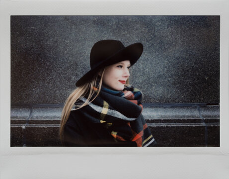 appy blond young woman with hat.