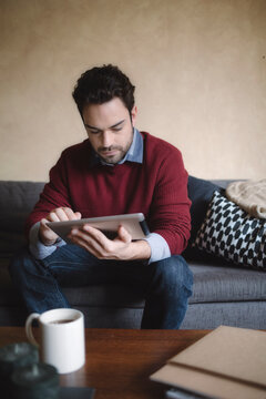 Caucasian Man Using a Tablet at Home