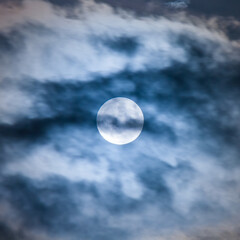 Full moon with mysterious cloud cover