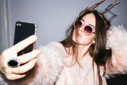 Young woman making selfie