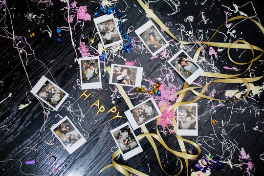 Polaroid photos of people on the dirty floor from the party