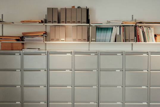 Stylish filing cabinet office storage in empty offive after hours
