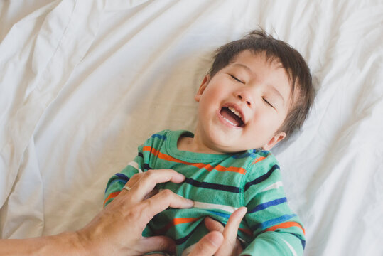 Toddler being tickled