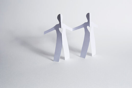 paper people holding hands...