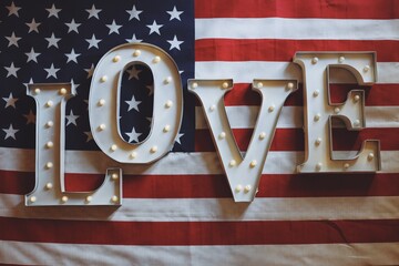 American Flag with the word LOVE on it in metal illuminated letters