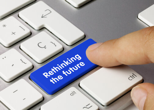 Rethinking The Future - Inscription On Blue Keyboard Key.