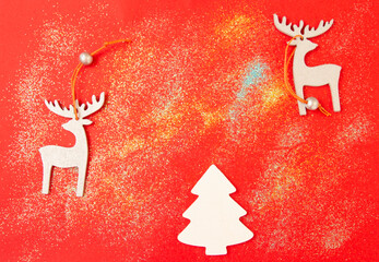 christmas silver reindeer on red silver background, top view
