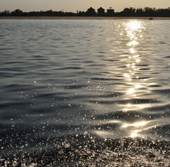 Volga river sparkles in the sunset in the summer