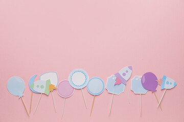 Stylish cupcake toppers on color background