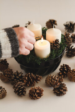 Lighting a Christmas candles