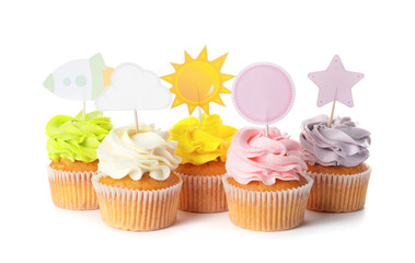 Tasty cupcakes with stylish toppers on white background