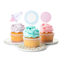 Tasty cupcakes with stylish toppers on white background