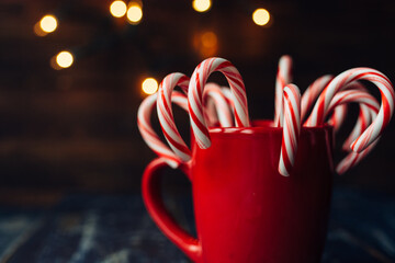 Christmas candy canes in a red cup