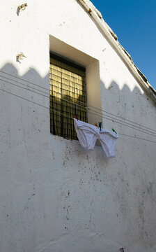 Two pairs of pants on a washing line.