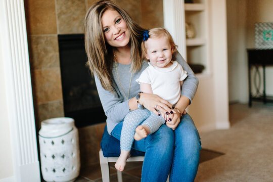 A mother with her toddler on her lap