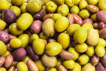 Tasty mix olives background.