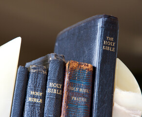Old leather bound bibles and prayer books.