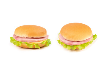 Sandwich with ham, cheese, lettuce on white background.