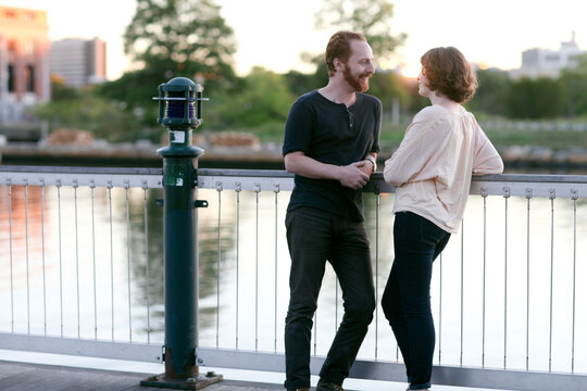 Couple talk near river