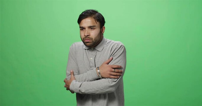 Terrified man looking around, green screen