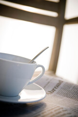 coffee cup on the newspaper