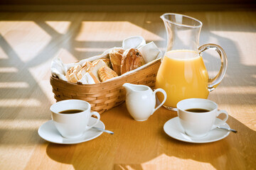 bread in the basket with coffee and juice
