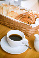 bread in the basket with coffee