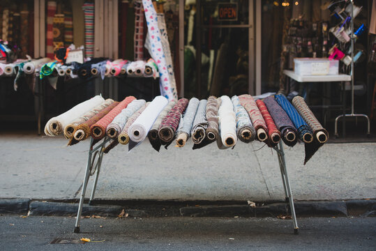 Rows of fabric for sale in the street