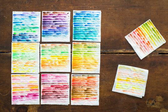 Colorful paper towel rags, used to clean off a paintbrush