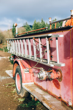 Ladder On Side Of Old Rusty Red Fire Truck