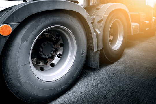 Close-up large a truck wheels and tires. Semi truck transportation. 